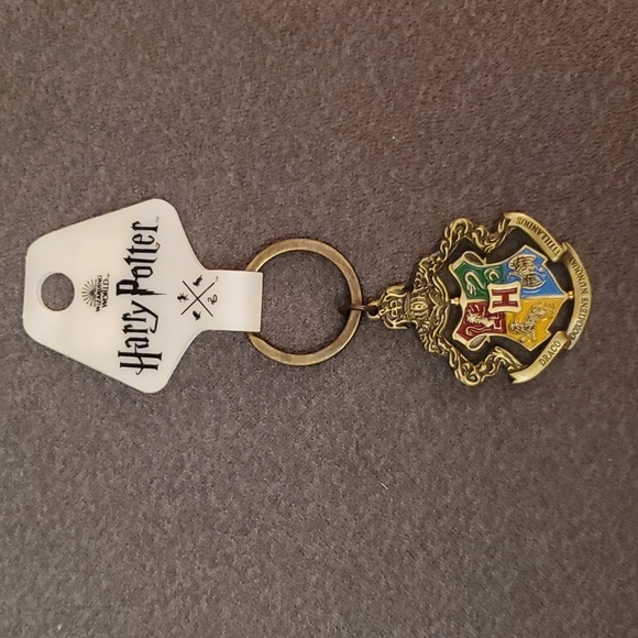 NWT Harry Potter metallic pivotal keychain. Four houses. From NYC store. - Picture 1 of 7